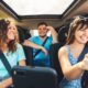 Friends driving in a car having fun on a roadtrip together