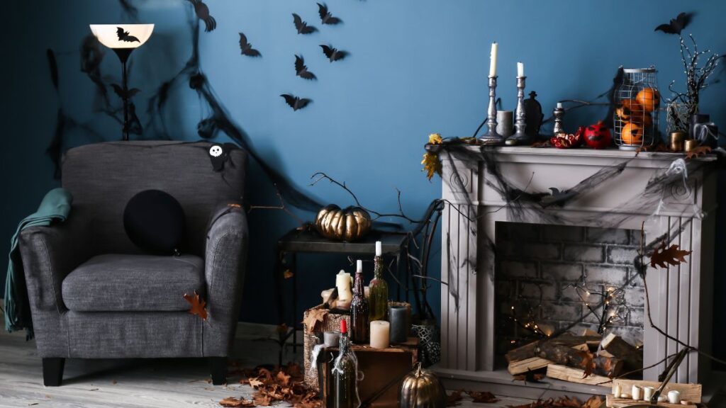 Chair and mantle setting with Halloween decor